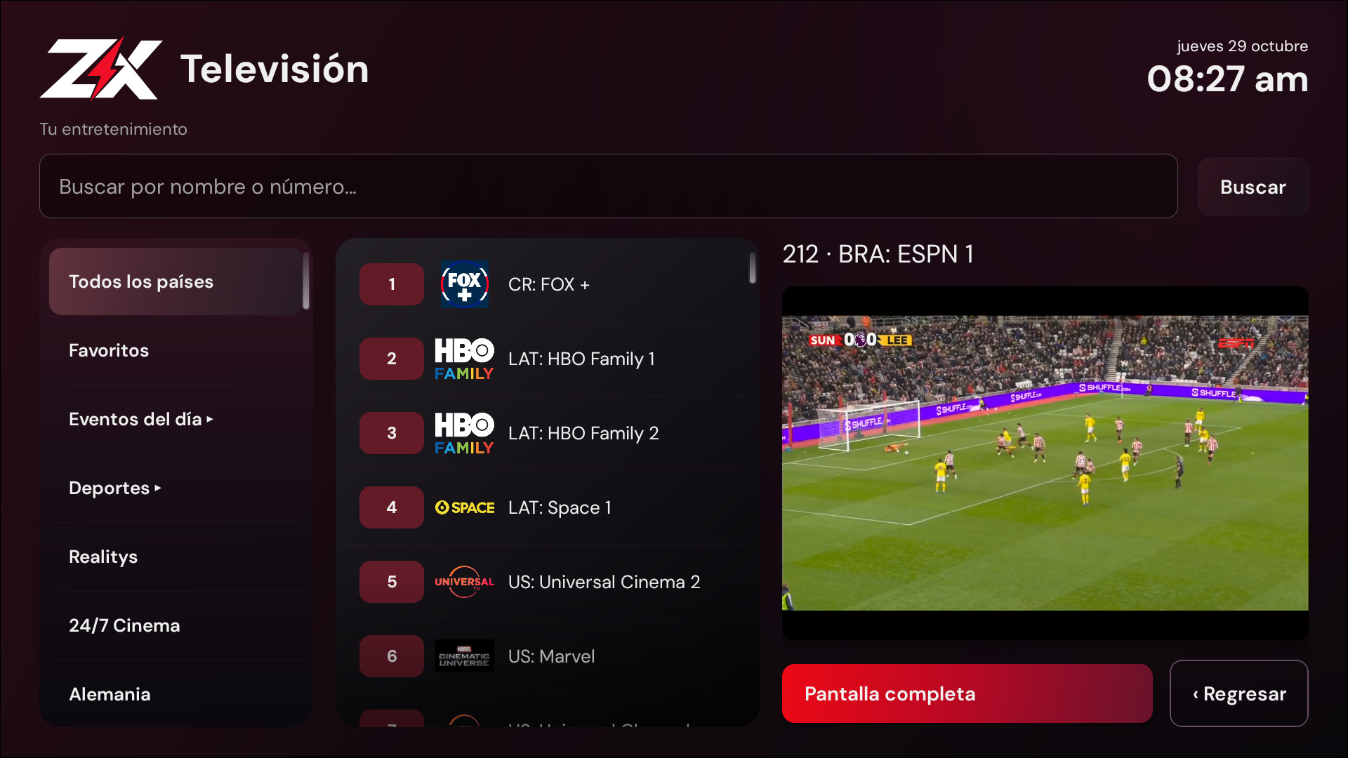 Captura real de ZeusX: lista de canales, buscador y televisión reproduciéndose